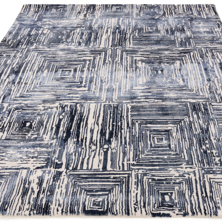 Tappeto Kuza geometrico blu scuro e bianco crema