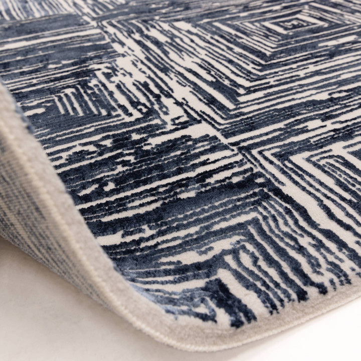 Tappeto Kuza geometrico blu scuro e bianco crema